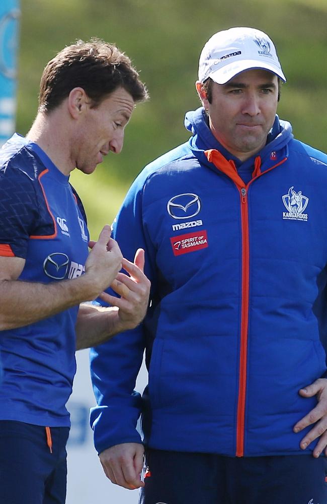 Brent Harvey with Brad Scott when the club announced he would not be given a new contract for 2017. Picture: Wayne Ludbey