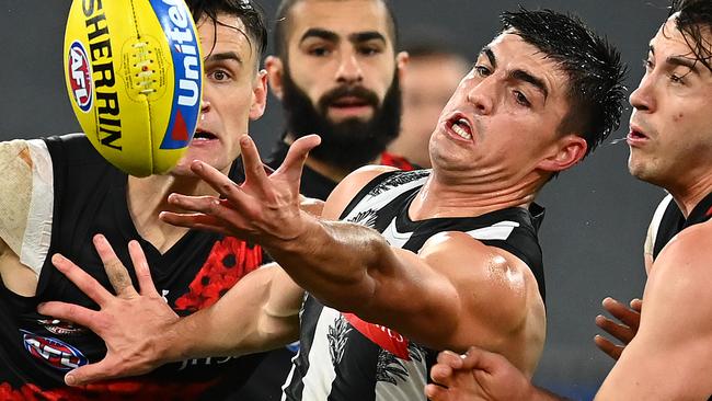 MELBOURNE, AUSTRALIA - JULY 03: Brayden Maynard of the Magpies and Andrew McGrath of the Bombers compete for the ball during the round 5 AFL match between the Collingwood Magpies and he Essendon Bombers at Melbourne Cricket Ground on July 03, 2020 in Melbourne, Australia. (Photo by Quinn Rooney/Getty Images)