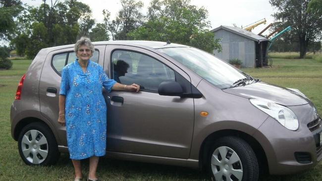 Grace Sneath with a new car in 1990, a year after first getting her driver's licence aged 65.