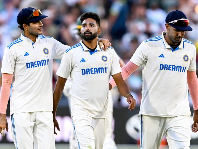 Indian bowler Mohammed Siraj walks off with Shubman Gill and Harshit Rana at the end of Day 3. Picture: William West/AFP.