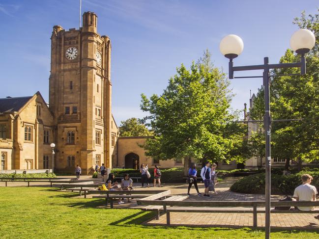 Melbourne, Australia - October 15, 2015: Students around the South Lawn of Melbourne University, before the Old Arts Clock Tower.