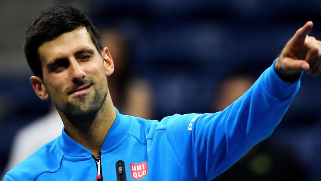 Novak Djokovic of Serbia celebrates defeating Jo-Wilfried Tsonga.