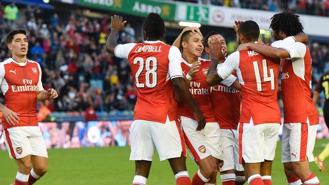 Arsenal's English forward Theo Walcott (2nd R) celebrates a goal.