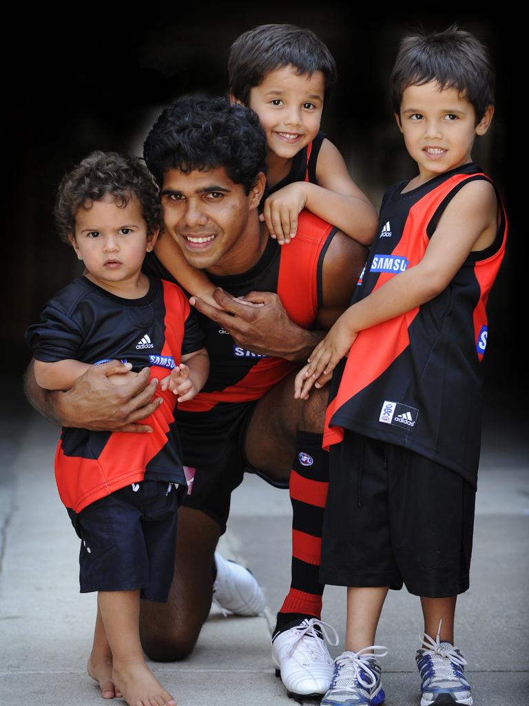 Alwyn Davey in his playing days with his sons Alijah, 2, and twins Alwyn Jr and Jayden, 5.