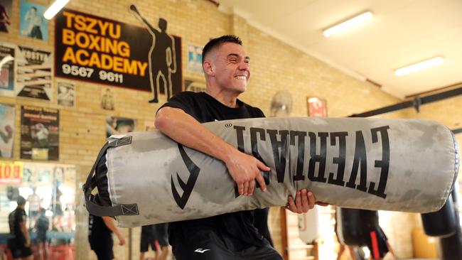 Tim Tszyu grapples with a heavy bag. Picture: Tim Hunter