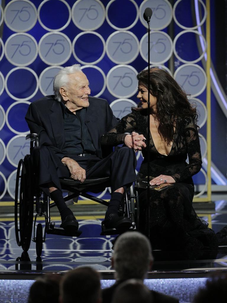 Kirk Douglas and Catherine Zeta Jones speak onstage during the 75th Annual Golden Globe Awards at The Beverly Hilton Hotel on January 7, 2018 in Beverly Hills, California. Picture: Getty