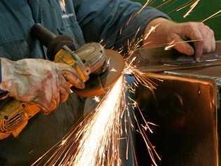 Sparks fly as a sheet metal worker fabricates a piece of mining equipment at Mastermyne Engineering.   Photo: Chris Ison / The Morning Bulletin. Picture: Chris Ison ROK270613cengineer9