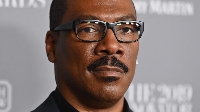 (FILES) In this file photo taken on November 6, 2019 US actor Eddie Murphy attends the WSJ Magazine 2019 Innovator Awards at MOMA in New York City. - The Golden Globes -- long known as Hollywood's favorite party, but rocked by recent scandals -- will attempt to stage a celebrity-filled comeback Tuesday, as films from Steven Spielberg's "The Fabelmans" to "Top Gun" and "Avatar" sequels compete for top honors. The Globes traditionally play a key role in kick-starting the movie awards season, but were taken off air last year amid controversy over ethical lapses and a lack of diversity in the Hollywood Foreign Press Association, which organizes the Beverly Hills gala. (Photo by Angela Weiss / AFP)