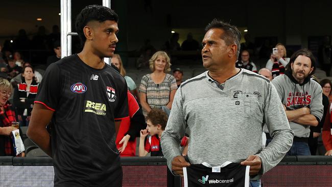 Nicky Winmar presents the No. 7 jumper to debutant Nasiah Wanganeen-Milera in Round 1. Picture: Michael Klein