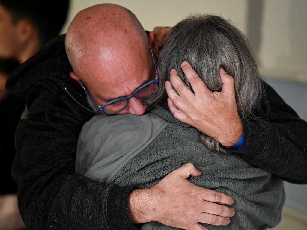 Sharon Hertzman Avigdori embracing her husband Hen Avigdori after she was released along with her daughter. Picture: ZACH / Israel Government Press Office / AFP