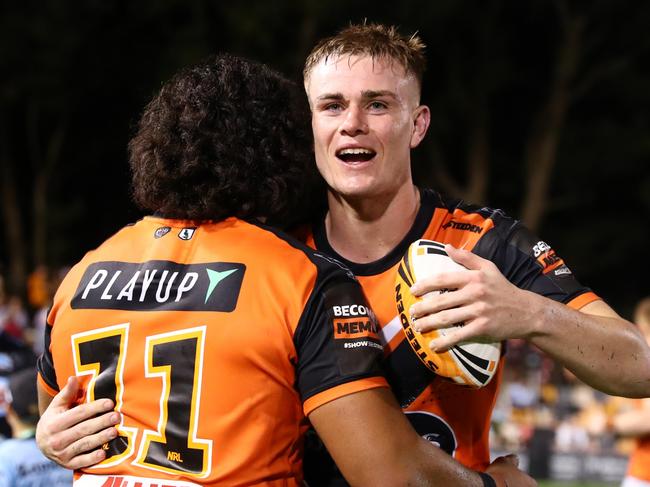 SYDNEY, AUSTRALIA - MARCH 23: Lachlan Galvin of the Tigers embraces with his teammate after winning the round three NRL match between Wests Tigers and Cronulla Sharks at Leichhardt Oval, on March 23, 2024, in Sydney, Australia. (Photo by Jeremy Ng/Getty Images)