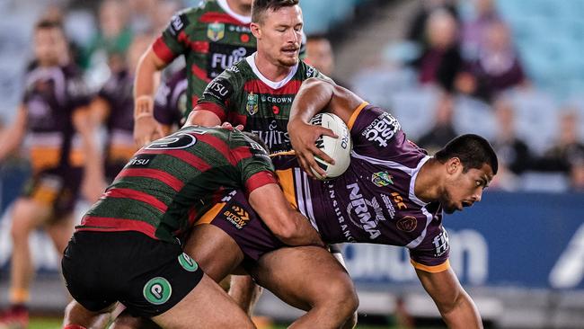 Payne Haas (right) of the Broncos is tackled by Robert Jennings of the Rabbitohs during the Round 8 NRL match between the South Sydney Rabbitohs and the Brisbane Broncos. Photo: AAP