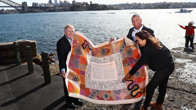 Former High Court judge Michael Kirby, Uphold and Recognise chairman Sean Gordon and filmmaker Rachel Perkins with the Uluru Statement in Sydney, 2018. Picture: John Feder