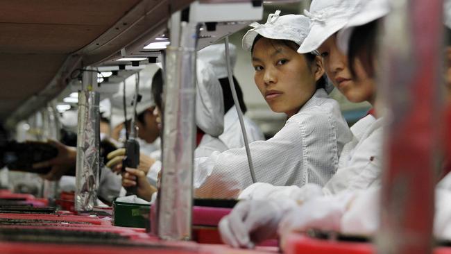 Workers inside a Foxconn factory in China. Picture: Reuters