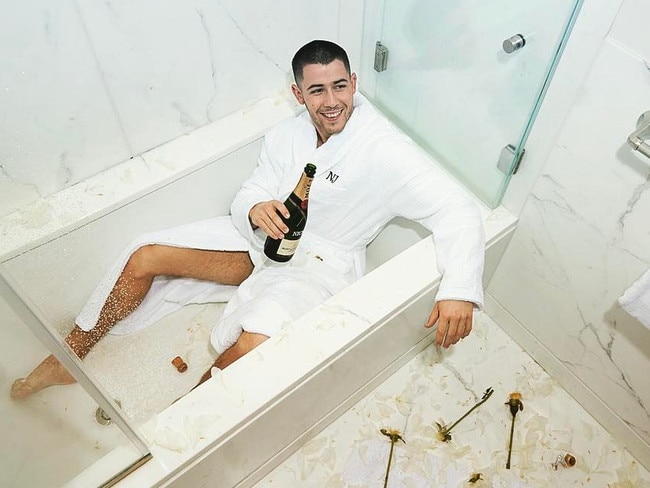 Nick Jonas celebrating in an empty bath with a bottle of bubbly, as you do... “That moment you hit 12 million followers! Thanks everyone!” Picture: Nick Jonas / Instagram