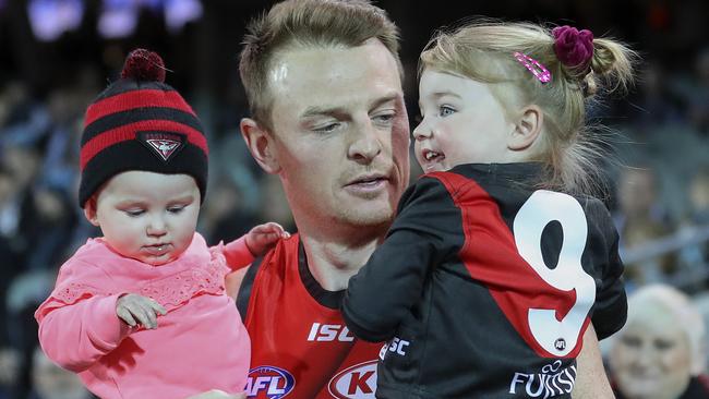 Brendon Goddard runs out with his children. Picture: Sarah Reed