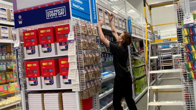 Officeworks Lismore staff making the final touches as the newly rebuilt store reopens after catastrophic floods in February.