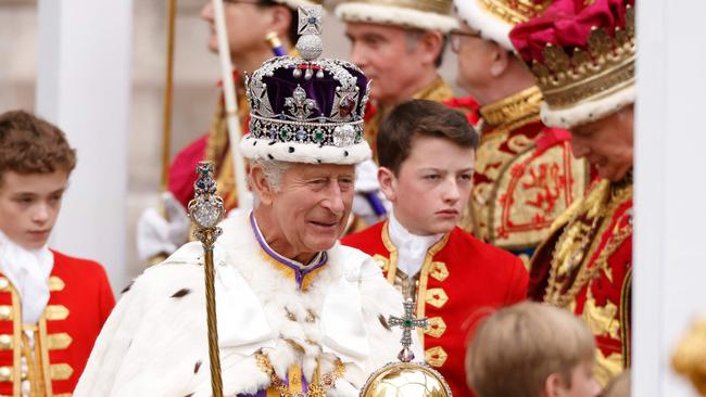 Britain's King Charles III wearing the Imperial state Crown carrying the Sovereign's Orb and Sceptre leaves Westminster Abbey after the coronation. Picture: Odd ANDERSEN / AFP