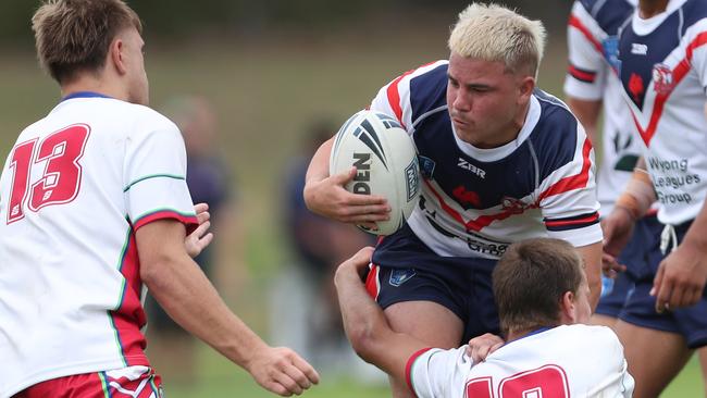 Chaice Bayley is tackled by Toby Ferris. Picture: Sue Graham. Laurie Daley Cup round one, Central Coast Roosters vs Monaro Colts at Morry Breen Oval, 3 February 2024