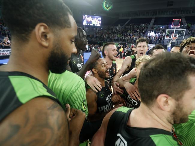 Phoenix celebrates its overtime win at Melbourne Arena.