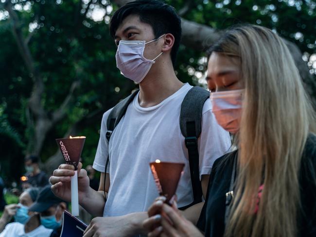 Participants hold candles as they take part in a memorial vigil in Victoria Park on June 4, 2020 in Hong Kong, China. Picture: Anthony Kwan/Getty Images