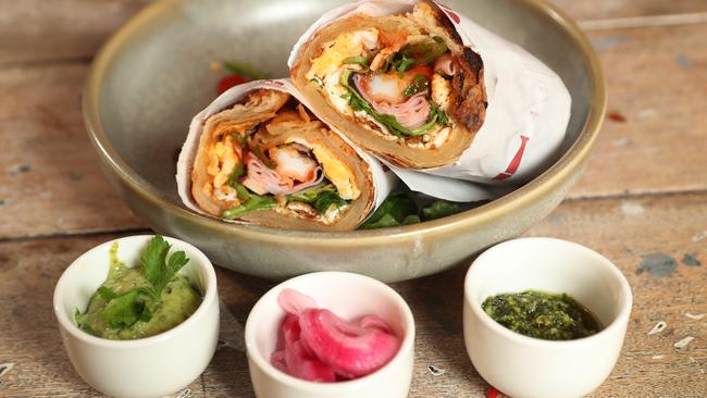 Pandit’s kathi roll with signature chutneys and pickled onions. Picture: David Crosling