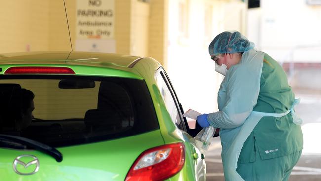 Health staff conduct tests at the COVID-19 testing centre in the Reactivating the Repat Hospital. Picture: Tracey Nearmy/Getty Images