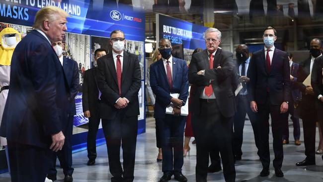 Mr Trump and Mr Meadows appeared without masks. The Ford executives did wear them, plus Mr Trump’s son-in-law Jared Kushner. Picture: Brendan Smialowski/AFP