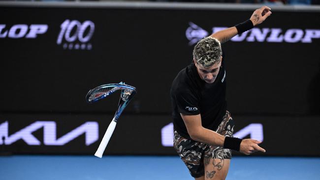 Kokkinakis breaks his racquet. Picture: William West / AFP