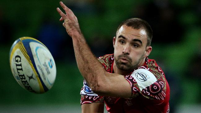 Super Rugby - Melbourne Rebels v Queensland Reds at AAMI Park, Reds Nick Frisby gets a pass away. June 27th 2014. Picture : Colleen Petch