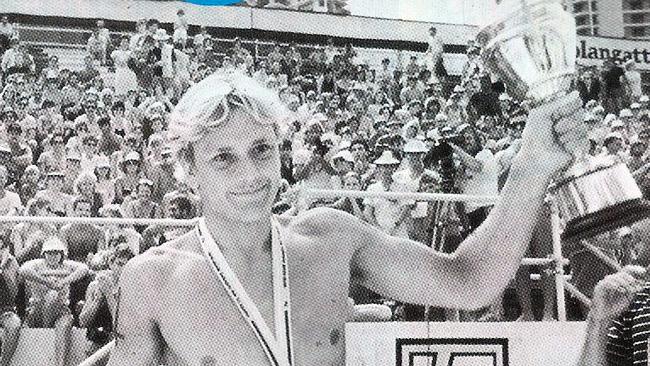 1984 Coolangatta Gold winner Guy Leech with his medal and trophy at Coolangatta beach.