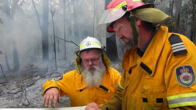 Lawrence RFS firefighter Darrell Binskin and Lawrence RFS captain Scott Campbell assess the bushfire in the Fortis Creek National Park north of Grafton on Friday, 28th October, 2016.Photo Bill North / Daily Examiner