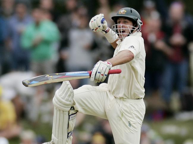 Michael Hussey celebrates his first Test century.