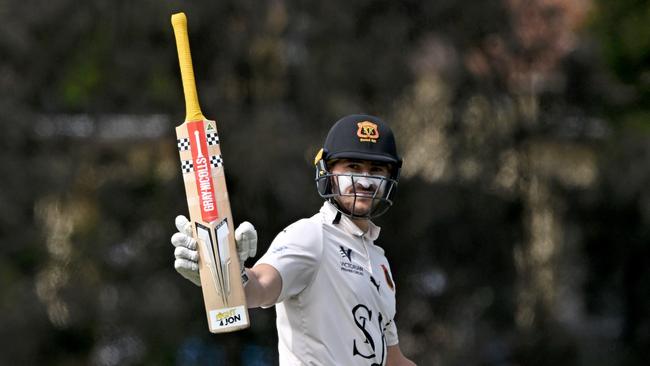 Jono Merlo raises his bat. Picture: Andy Brownbill