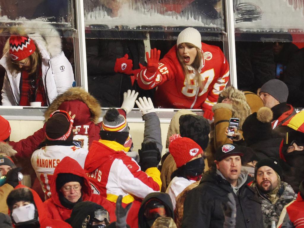 Taylor Swift celebrates with fans during the AFC Wild Card Playoffs between the Miami Dolphins and the Kansas City Chiefs. Picture: Jamie Squire/Getty Images/AFP