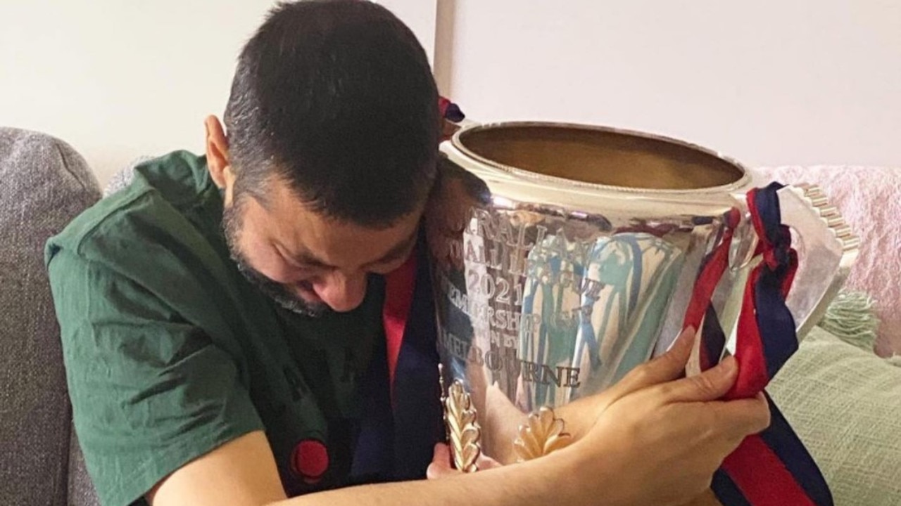 Warren Costabile embraces the premiership Cup. Photo: Instagram / chloesacco.cmc