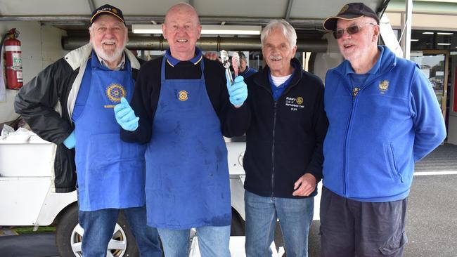 Collin Brimkmann, Glen Riddle, Cliff Heath and Jim Sawyer ready to serve up some hot hamburgers and sausages.