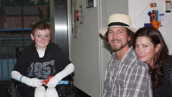 Eddie and Vill Vedder with EB sufferer Garrett Spaulding in the US. The Vedders are co-founders of the EB Research Partnership, which is searching for a cure for the debilitating disease. Picture: supplied