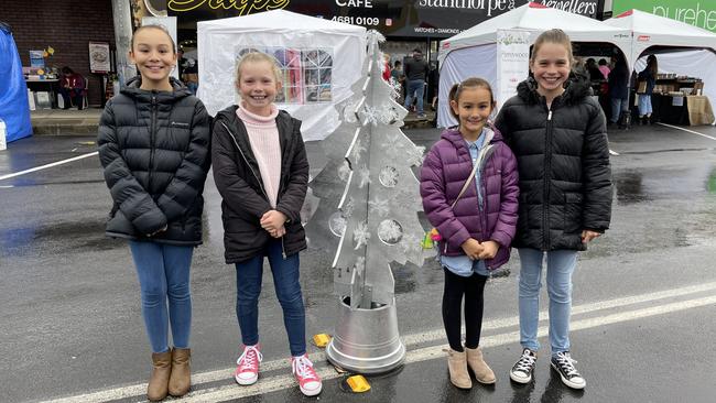 Stanthorpe Netball friends Ava Hobba (11), Isabella Jackson (9), Stella Hobba (8) and Ashley Jackson (11) just came from volunteering at the sausage sizzle at Snowflakes in Stanthorpe 2021. Photo: Madison Mifsud-Ure / Stanthorpe Border Post