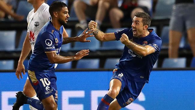 Jets striker Ronny Vargas, left, celebrates with teammate Jason Hoffman after scoring the opening goal against Wellington Phoenix last night. Picture: Getty Images