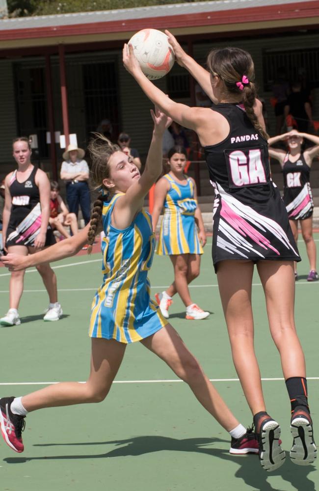 Aztecs 11 and Pandas 8 players battle for possession in the 14/15 years Division 1 grand final. Picture: Gary Reid