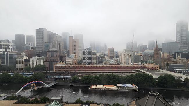 Melbourne city blanketed in fog on Tuesday. Picture: Brenton Edwards