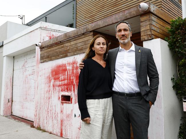 Executive Council of Australian Jewry Co-CEO Alex Ryvchin with his wife Vicki outside their old home in Dover Heights that was targeted in another anti-Semitic attack with cars torched, hate messages sprayed on them and the house was also splashed with red paint. Picture: Jonathan Ng