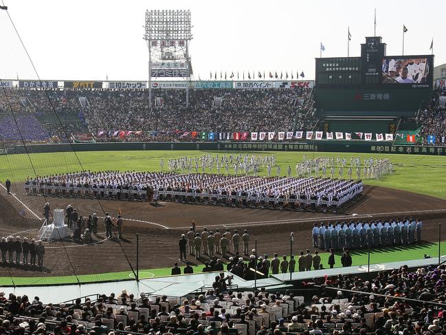 (032208 Osaka, Japan ) Players representing 36 teams stood in formation after they marched onto the field as part of the opening ceremony at Hanshin Koshien Stadium for the national high school baseball tournament on Saturday, March 22, 2008. Staff Photo by Matthew West. (Photo by Matthew West/MediaNews Group/Boston Herald via Getty Images)