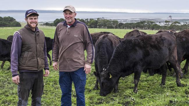 Alex Hammond and father Keith on their Robbins Island property, the site of the proposed wind farm. Picture: Chris Crerar