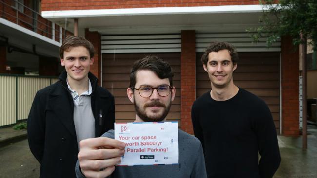 App creators Alex Peck and Jack Perkins with head of technology Peter Carey (centre). Picture: Craig Wilson