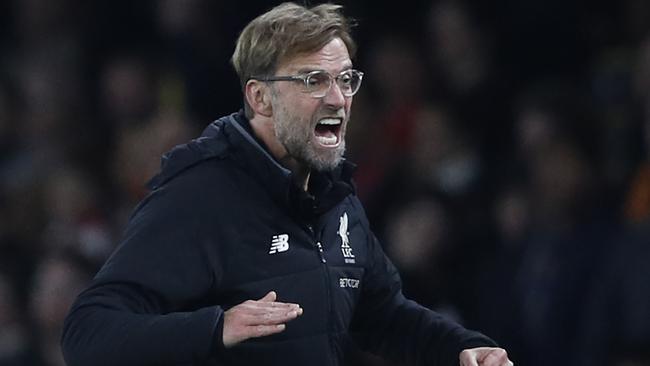 Liverpool's German manager Jurgen Klopp gestures during the English Premier League football match between Arsenal and Liverpool at the Emirates Stadium in London on December 22, 2017.  / AFP PHOTO / Adrian DENNIS / RESTRICTED TO EDITORIAL USE. No use with unauthorized audio, video, data, fixture lists, club/league logos or 'live' services. Online in-match use limited to 75 images, no video emulation. No use in betting, games or single club/league/player publications.  /