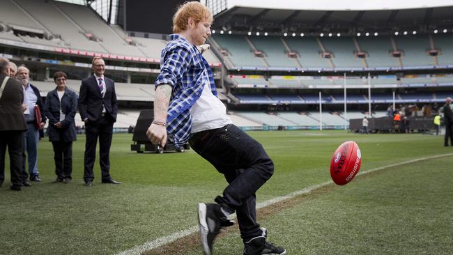 Having a go ... Ed Sheeran kicks his personalised Sheeran Sherrin. Picture: Nathan Dyer