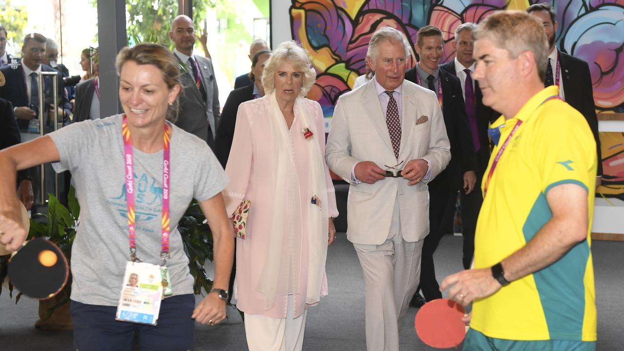 Prince Charles, Prince of Wales (second right) and Camilla, Duchess of Cornwall watch athletes playing table tennis during a visit to the Athlete's Village on the Gold Coast, Thursday, April 5, 2018. (AAP Image/AFP Pool/William West)