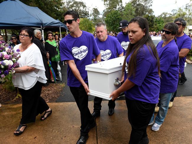 Pallbearers – including Rick Thorburn (centre) – carry the coffin of murdered schoolgirl Tiahleigh Palmer during her funeral in Cornubia, south of Brisbane, on November 14, 2015. Picture: AAP Image/Dan Peled